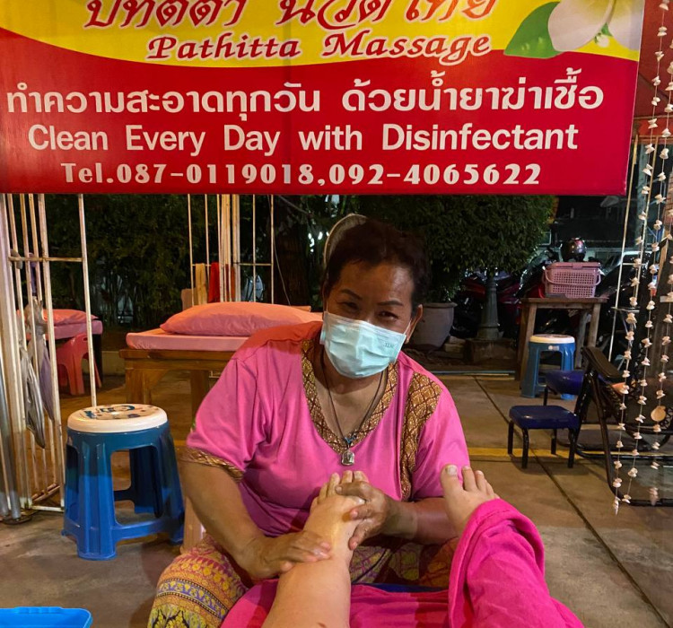 Thai foot massage on the food market